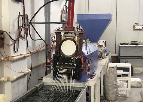 Plastic reprocessing line converting material into strands